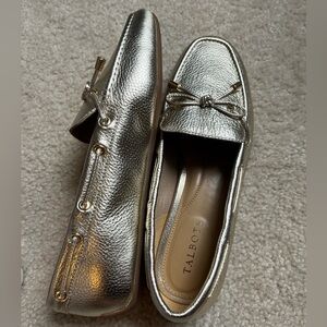 A pair of flats made by talbots. Size is a women’s medium.